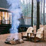 Cozy outdoor seating by a firepit, symbolizing warmth and connection, illustrating how talk therapy works with trauma.
