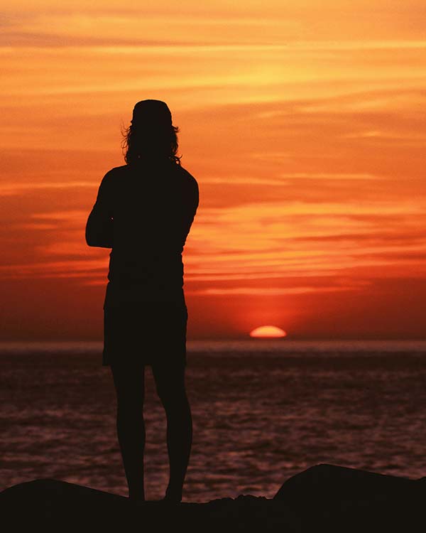 A man looking at the ocean after having Trauma Therapy in Arlington