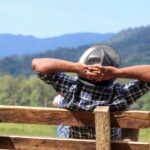 White flower against a textured brown background, symbolizing growth and explaining how does trauma-focused therapy work.