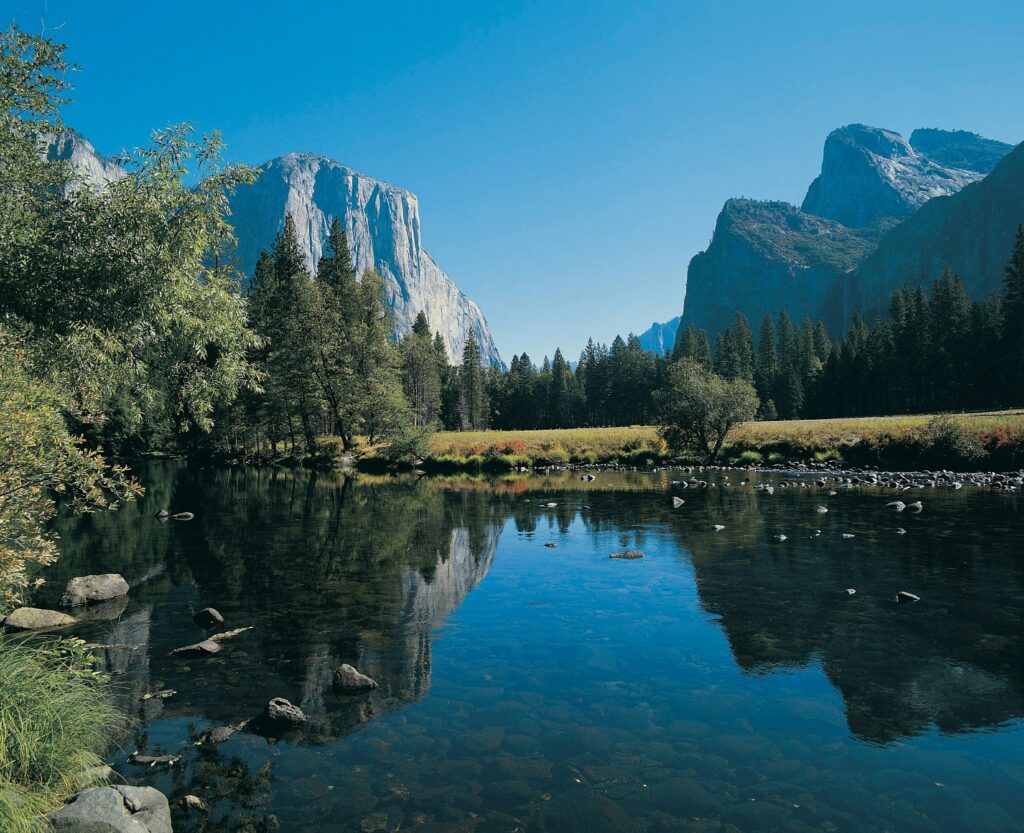 Mountain landscape with water and open sky, expansive view expressing calm, balance, and perspective