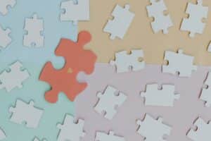 Puzzle pieces symbolizing the healing process and building understanding during a first trauma-focused CBT therapy session.