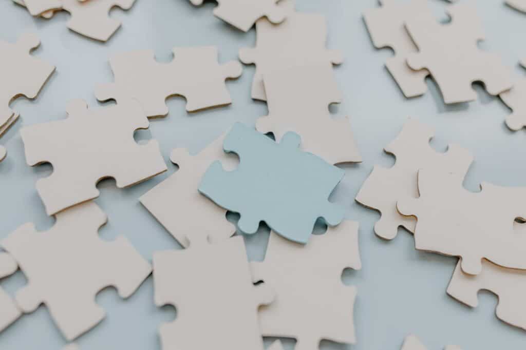 Puzzle pieces representing internal parts and integration in Internal Family Systems Therapy