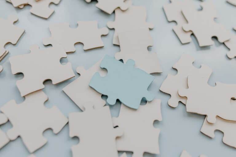 Puzzle pieces representing internal parts and integration in Internal Family Systems Therapy