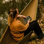 White flower against a textured brown background, symbolizing growth and explaining how does trauma-focused therapy work.