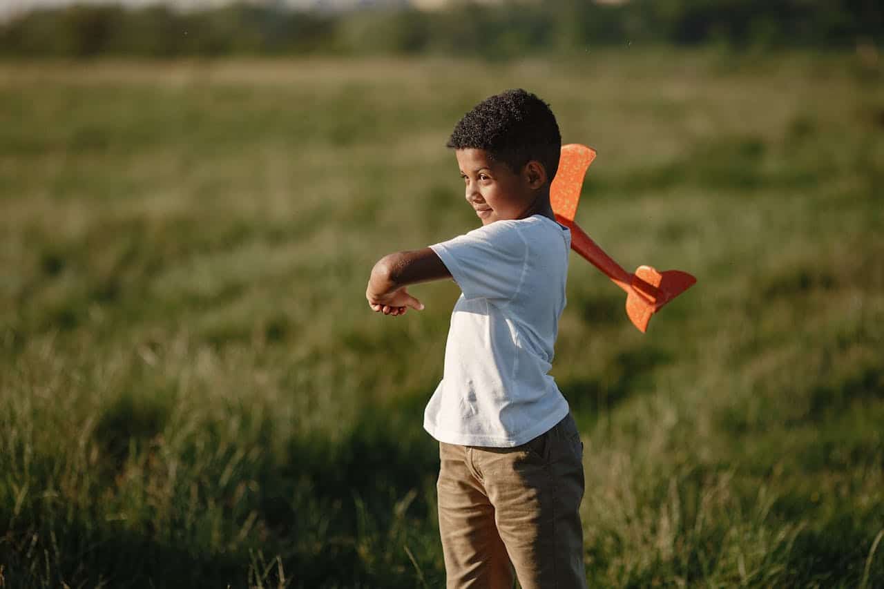 Young child playing outdoors symbolizing early childhood experiences and emotional development