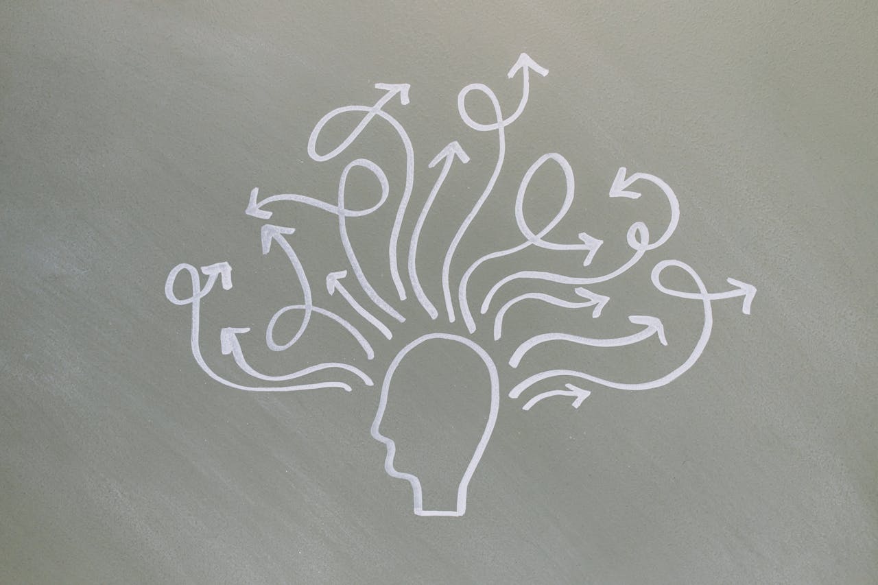 Illustration of multiple thought directions symbolizing cognitive processing and mental patterns in CBT and hypnotherapy for trauma recovery