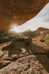 Sunrise over a mountain landscape with warm light spreading across peaks, symbolizing new beginnings and a sense of hope ahead.